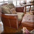 F14. Leather and fabric club chair and ottoman from Domain Furniture. 38”w 